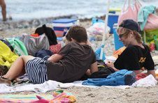 Thumbnail students relaxing on the beach