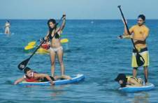 Thumbnail paddling on a surfboard at the watersports camp